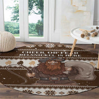 Brown round Christmas rug with large Belsnickel graphic and winter motif border