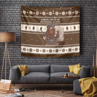 Brown tapestry showing Belsnickel, reindeer silhouettes, and snowflake pattern