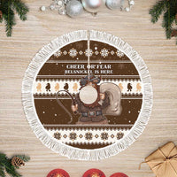 Round brown tree skirt with wide white fringe, Belsnickel illustration and 'Cheer or Fear'.
