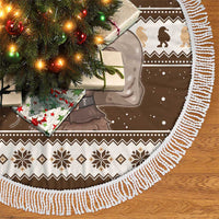Brown tree skirt featuring Belsnickel scene with white tassel fringe and holiday pattern.