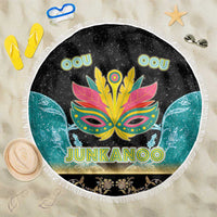 Round Junkanoo beach blanket with fringe edge, black center and colorful mask logo