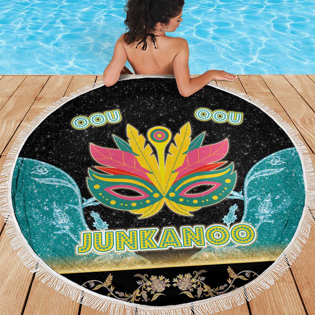 Round Junkanoo beach blanket with fringe edge, mask and 'JUNKANOO' text in center