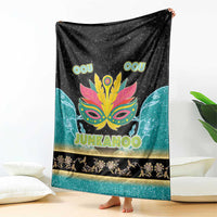 Black and teal Junkanoo blanket draped, featuring neon mask design and 'JUNKANOO' text
