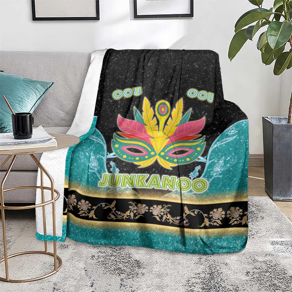 Neon Junkanoo blanket with black top and teal sides, featuring mask graphic and 'JUNKANOO'