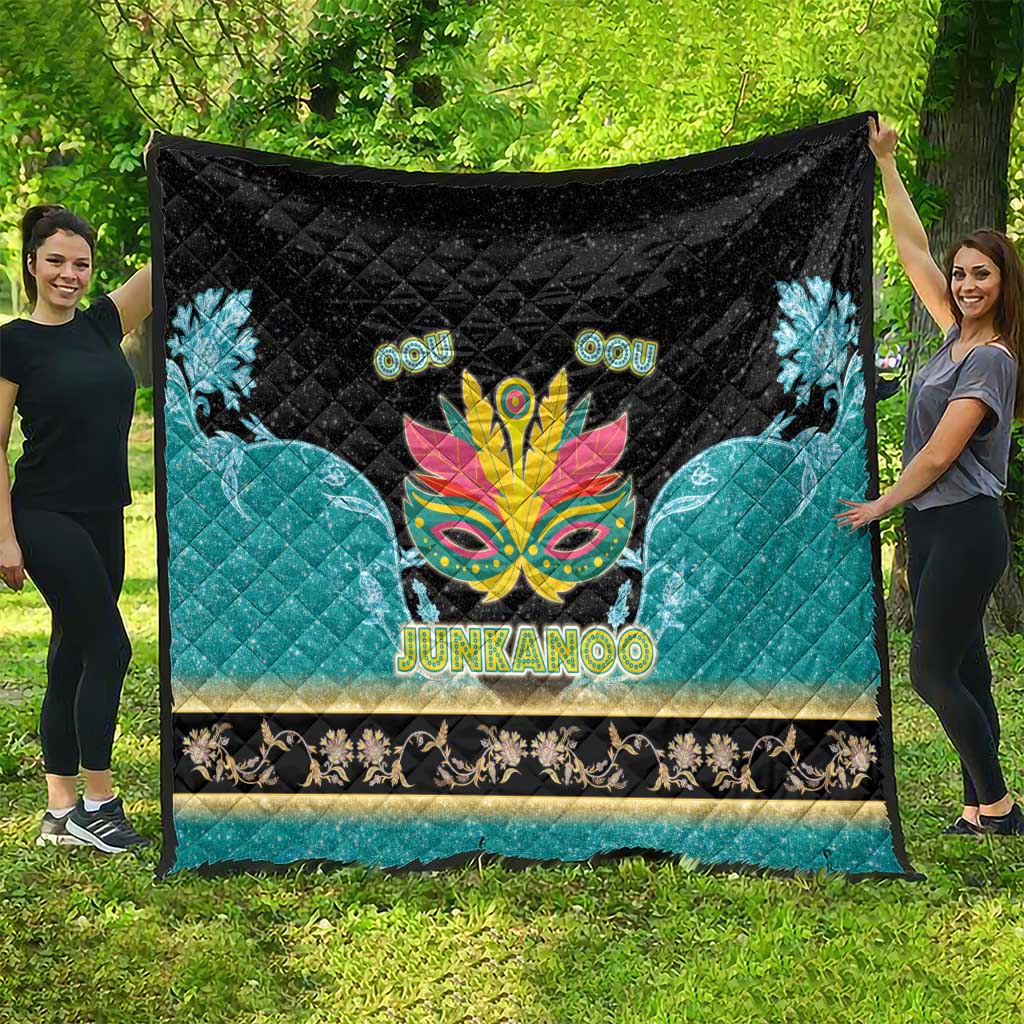 Junkanoo-themed quilt, black top with central carnival mask, teal panels, 'JUNKANOO'