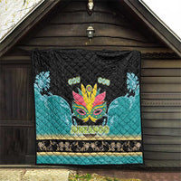 Junkanoo-themed quilt hanging, black-and-teal with carnival mask and 'JUNKANOO' text