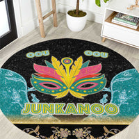 Round black area rug with colorful Junkanoo mask graphic and JUNKANOO lettering
