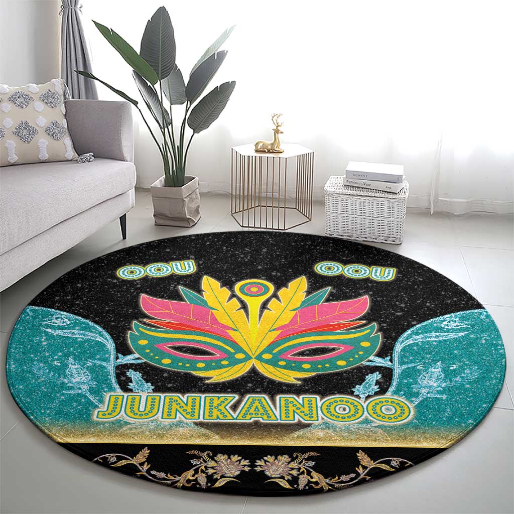 Round black area rug featuring bright Junkanoo mask with JUNKANOO lettering and teal flourishes
