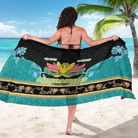Junkanoo sarong draped wide, black and teal with central mask graphic and 'OU' text
