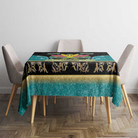 Rectangular tablecloth centered on table: black top band, teal base, gold trim and crest