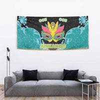 Colorful Junkanoo tapestry with mask artwork, teal birds, and decorative gold trim