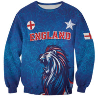 Blue football sweatshirt with England logo, lion graphic, star and flag patches