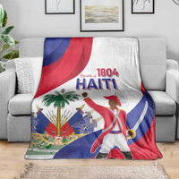 Haiti independence day blanket draped over a gray sofa, featuring 1804 Haiti and flag art