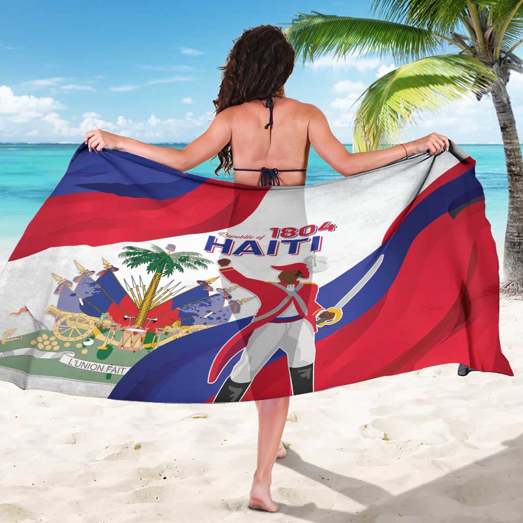 Haiti independence sarong, white with red-blue waving flag and central figure graphic.
