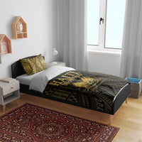 Gold and dark patterned duvet cover with 'HAITI 1804' emblem over bed