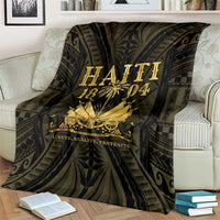 Haiti 1804 blanket on sofa, dark with gold 'HAITI 1804' lettering and emblem