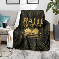 Haiti 1804 blanket, dark with gold 'HAITI 1804' emblem over a sofa seat
