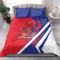 Haiti bedding set on bed: red duvet with blue zigzag stripe, coat of arms, and two blue pillows