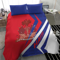 Haiti bedding set view: red duvet with coat of arms and blue-and-white diagonal stripe plus two blue pillows