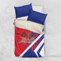 Haiti bedding set on light background: red-and-blue duvet with coat of arms and two blue pillows