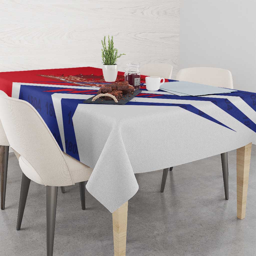 Red and blue tablecloth with white diagonal band and Haiti 1804 design