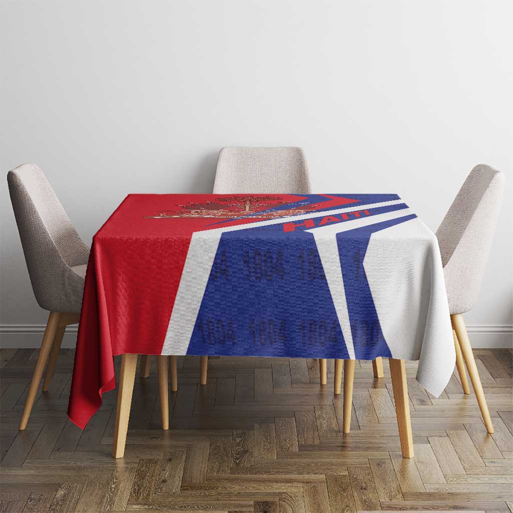 Red and blue tablecloth with white and blue diagonal bands and Haiti 1804 text