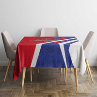 Red and blue tablecloth with white and blue diagonal bands and Haiti 1804 text
