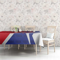 Red and blue tablecloth with Haiti 1804 lettering and coat of arms, draped on table