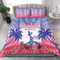 Bedding set on bed with Haiti text, statue silhouette, palms, and red patterned border