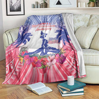 Blue, pink, and white Haiti independence blanket with palm trees, flowers, and seated statue