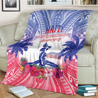 Blue, white, and pink Haiti independence blanket on couch with floral wreath and statue