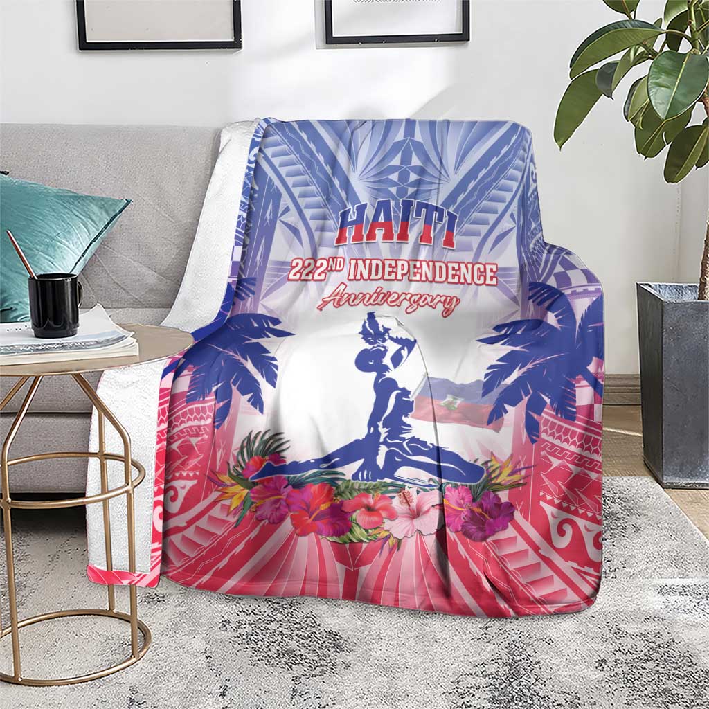 Blue and pink Haiti independence blanket on floor with palm trees, flowers, and statue
