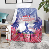 Blue and pink Haiti independence blanket on floor with palm trees, flowers, and statue