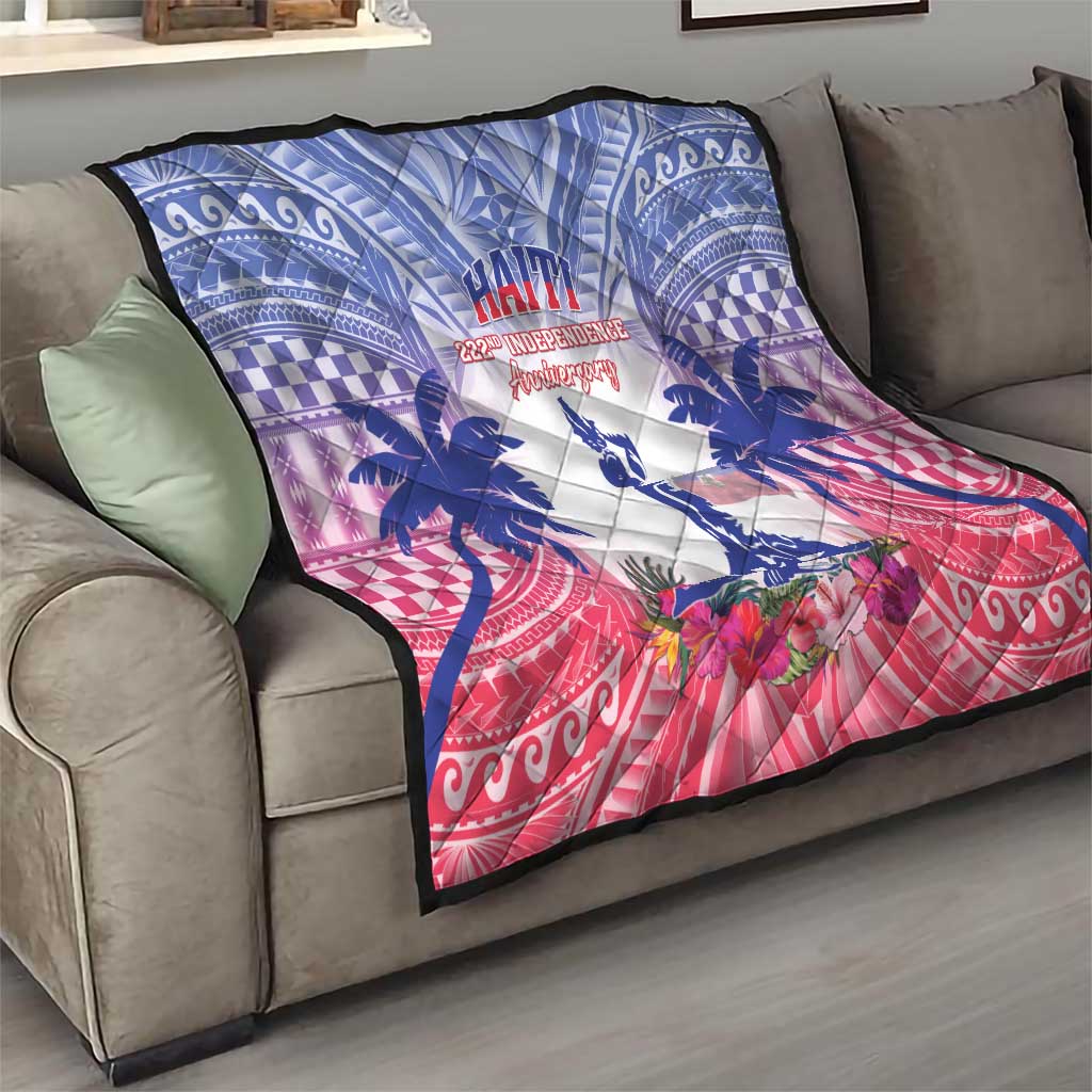 Blue, white and red Haiti Independence Day quilt folded on sofa with palm and floral motif