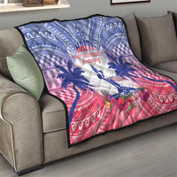 Blue, white and red Haiti Independence Day quilt folded on sofa with palm and floral motif