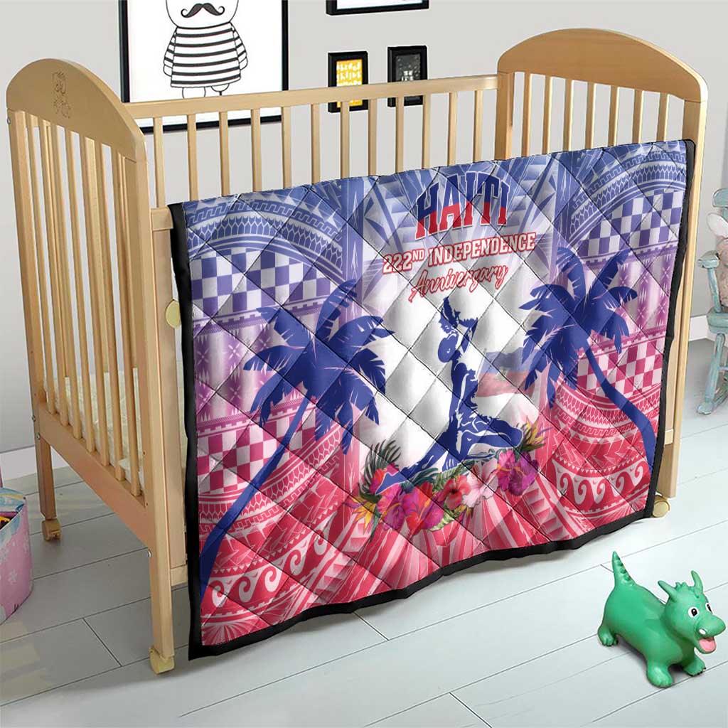 Haiti Independence Day quilt over a crib mattress in blue, white and red tropical print