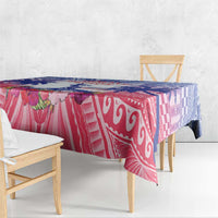 Rectangular tablecloth draped over bench with maroon geometric prints and blue trim