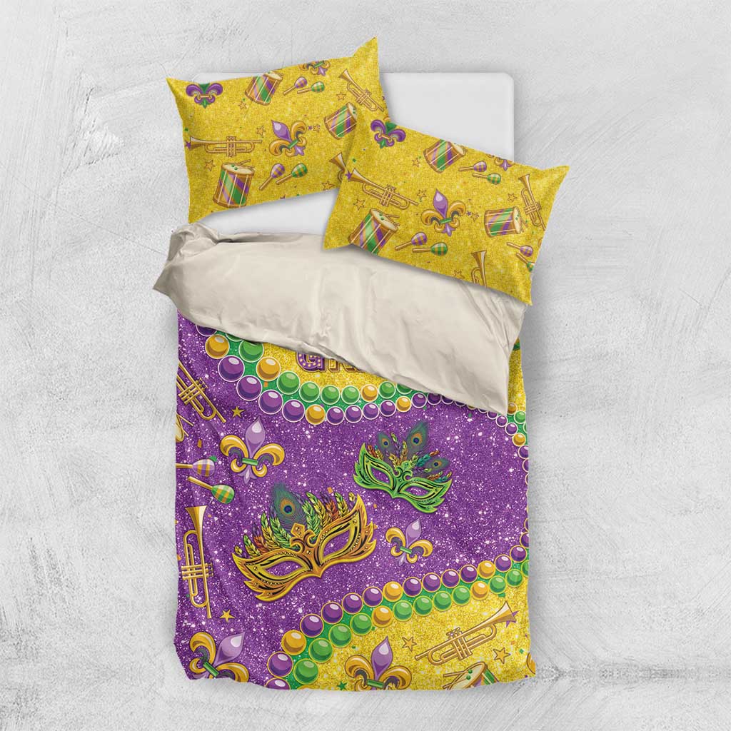 Mardi Gras glitter bedding set with purple and gold comforter and two yellow patterned pillowcases