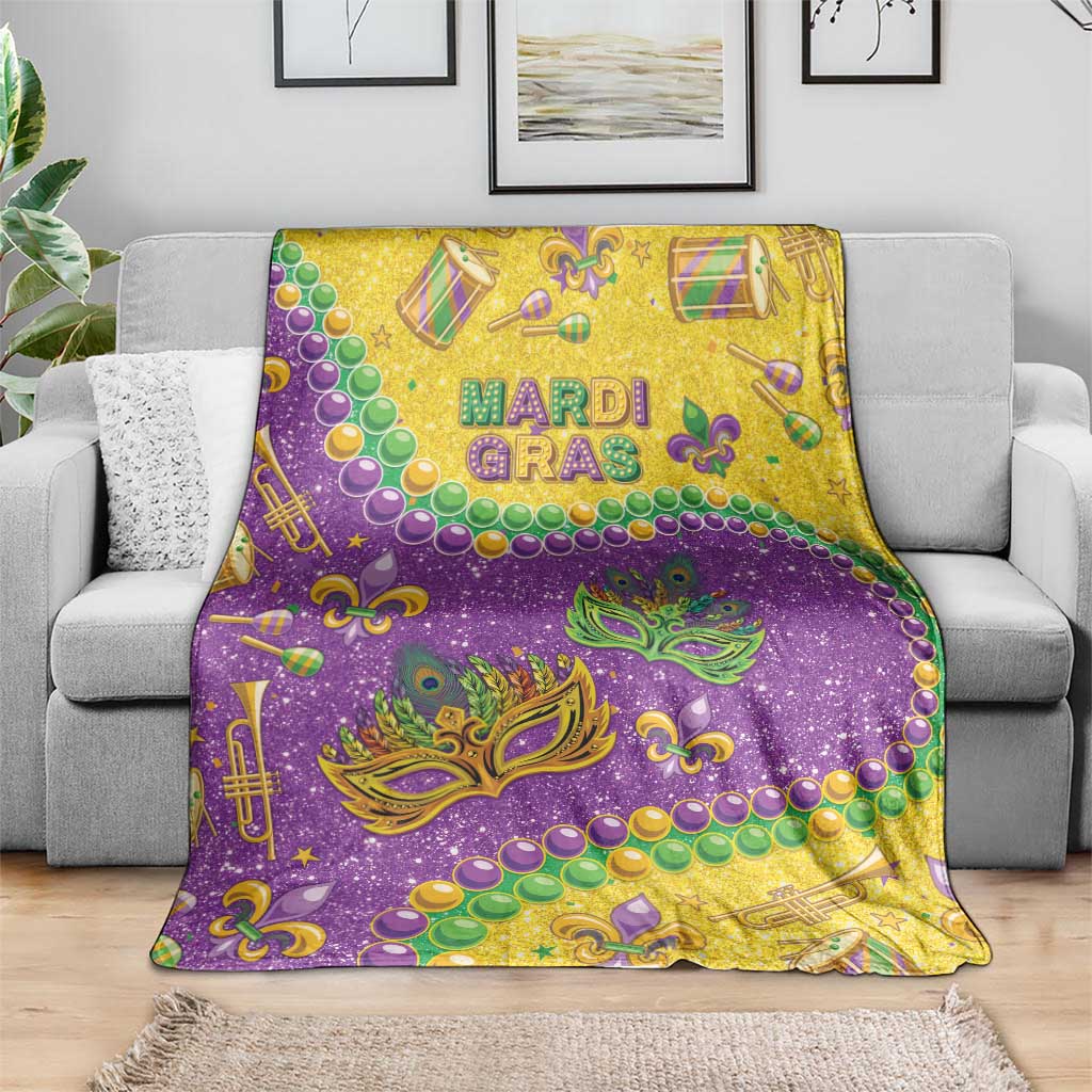 Mardi Gras glitter blanket in purple and gold with masks, bead garlands, and trumpet accents