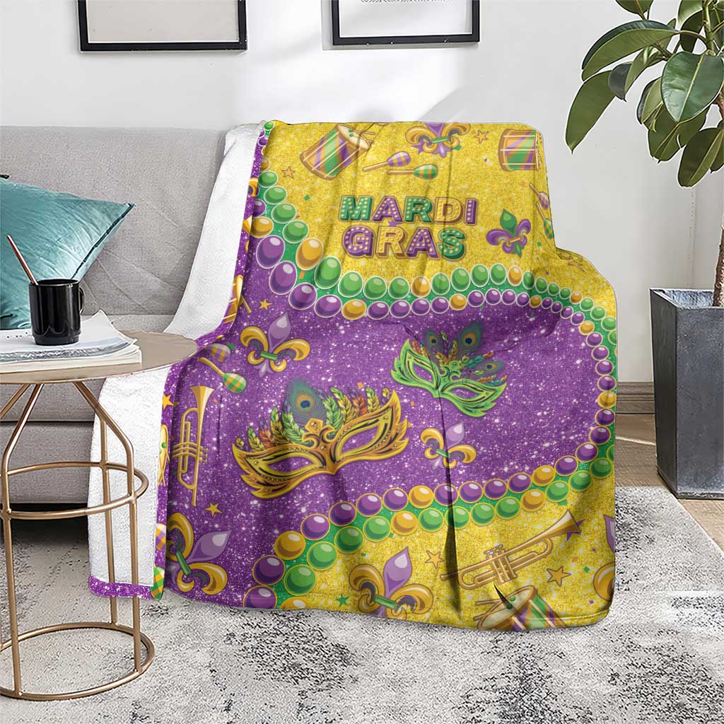 Mardi Gras glitter style blanket in purple and gold with fleur-de-lis masks and beads