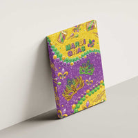 Glitter Mardi Gras canvas wall art tilted against a light wall with beads and masks