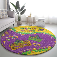 Round Mardi Gras glitter rug on floor, purple with gold mask, green leaves, multicolor beads.