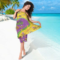 Colorful glitter sarong, purple and yellow design with bead rows and fleur-de-lis accents