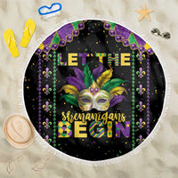 Round black beach blanket with Mardi Gras fleur-de-lis beads, gold mask and white fringe