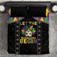 Black Mardi Gras bedding set, top view, with diamond corners, masked face art, and bright 'Begin' text