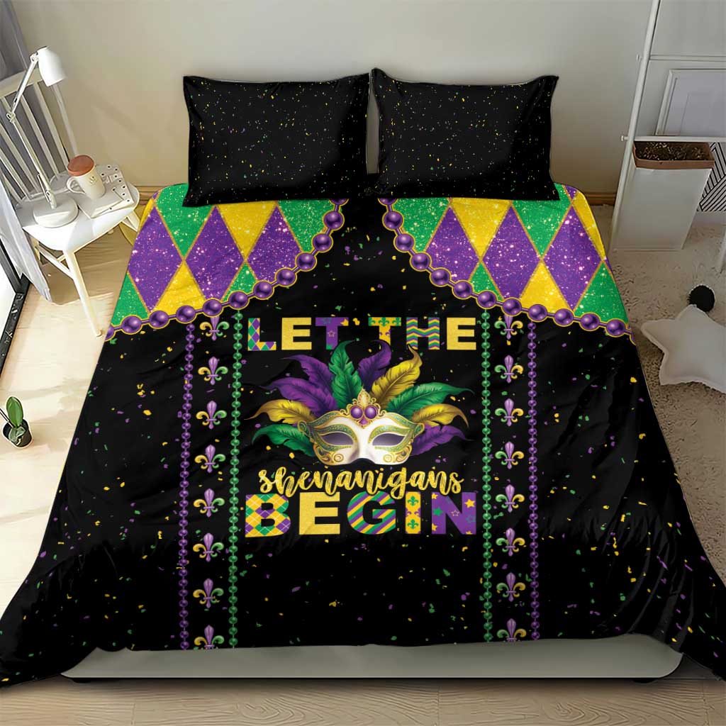 Black Mardi Gras bedding set with colorful diamond border and masked face design centered on duvet