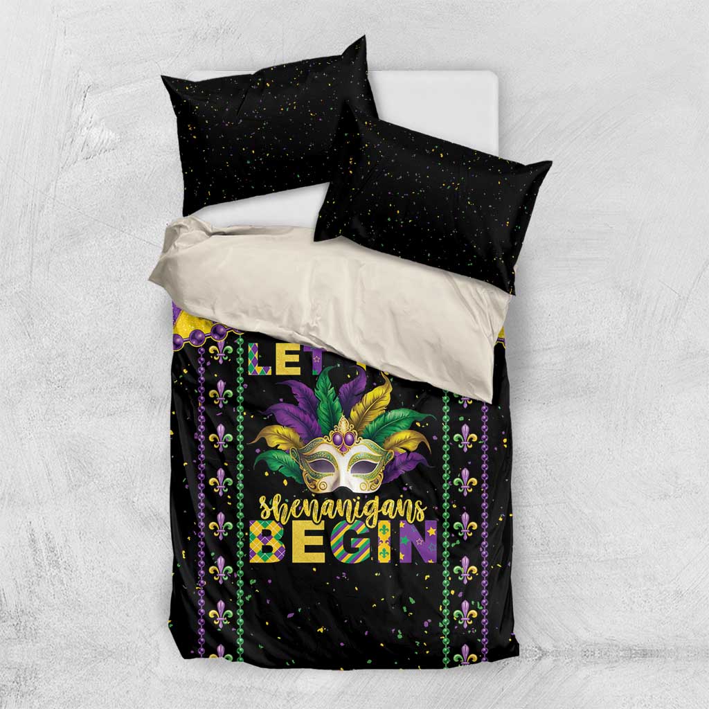 Black Mardi Gras bedding set with diamond border design, masked face graphic, and two matching pillowcases