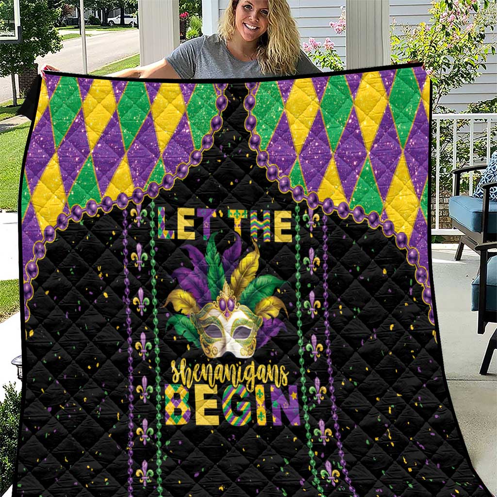 Black Mardi Gras quilt with purple, green, and yellow diamond border and fleur-de-lis text