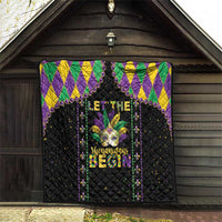 Black Mardi Gras quilt hanging on outdoor wall with colorful fleur-de-lis and “Let the…” text