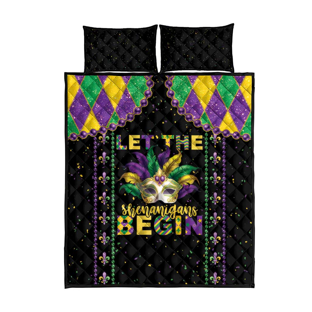 Black quilt bed set with two matching pillow shams; Mardi Gras text and fleur-de-lis graphic